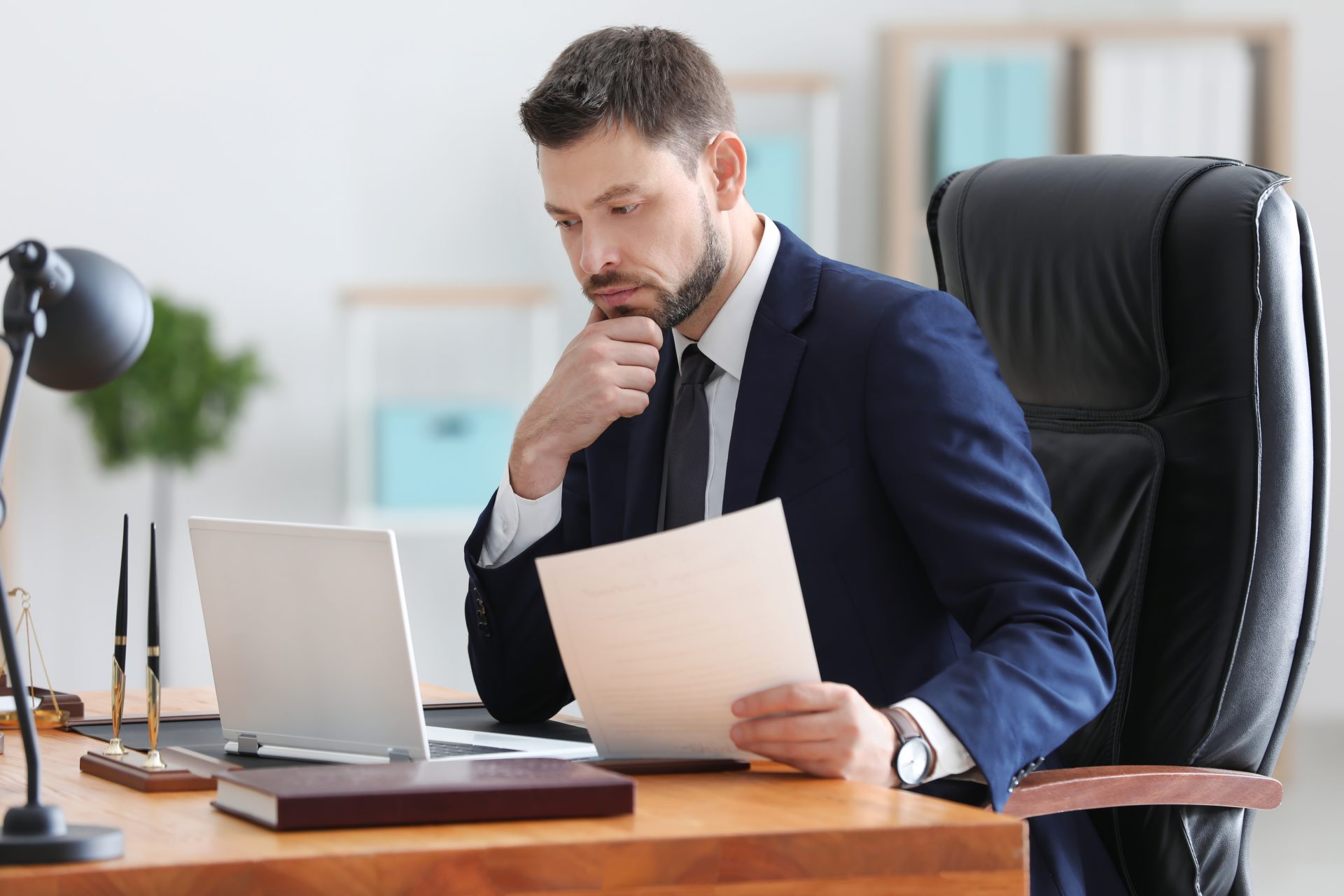 Young male notary working in office